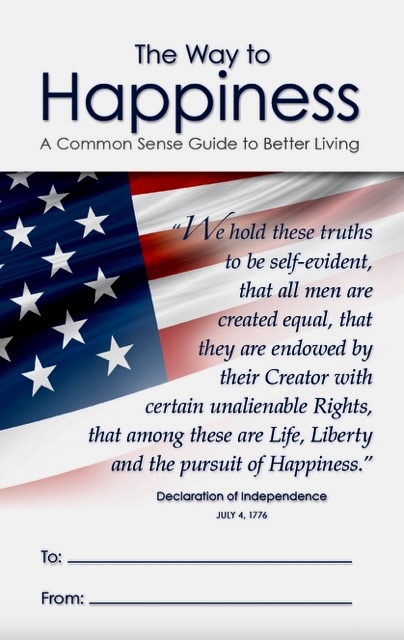 The Way to Happiness booklet cover with an American flag, a Declaration of Independence excerpt, and gift inscription lines